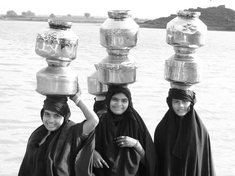 Water portraits - Procuring water from a pond located on village outskirts - Bhavnagar district, Gujarat